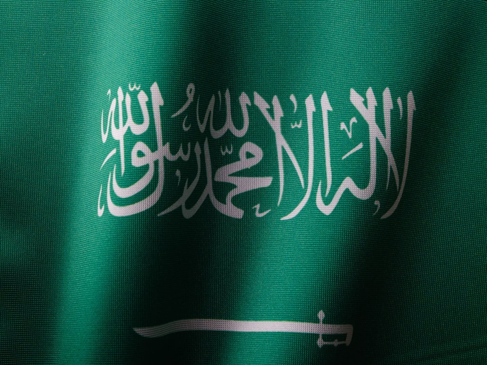 a close up of a green and white flag