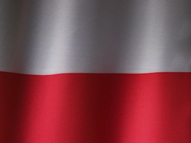 a close up of a red and white curtain