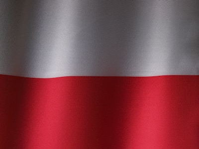 a close up of a red and white curtain