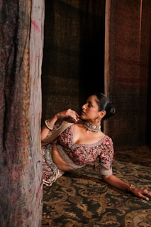 Wealthy Moroccan woman relaxing in a modern living room with smart lighting and security cameras.