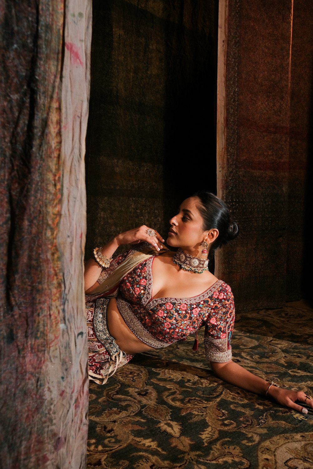 a woman sitting on the floor in a room