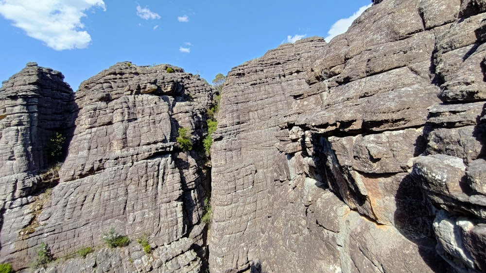 a rock formation with a sky in the background