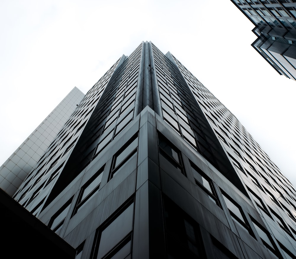 looking up at a tall building in the city