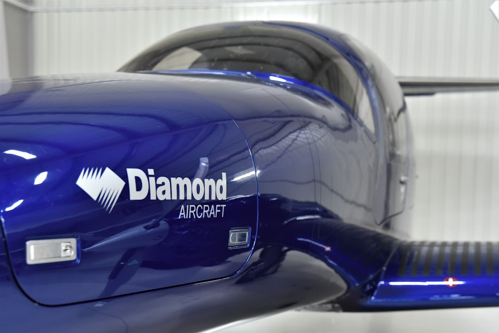a close up of the side of a blue airplane