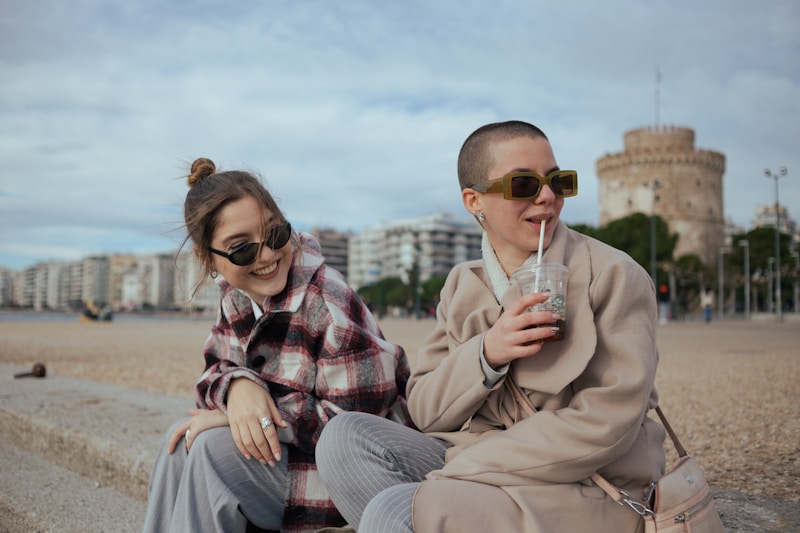 a man and a woman sitting on the beach