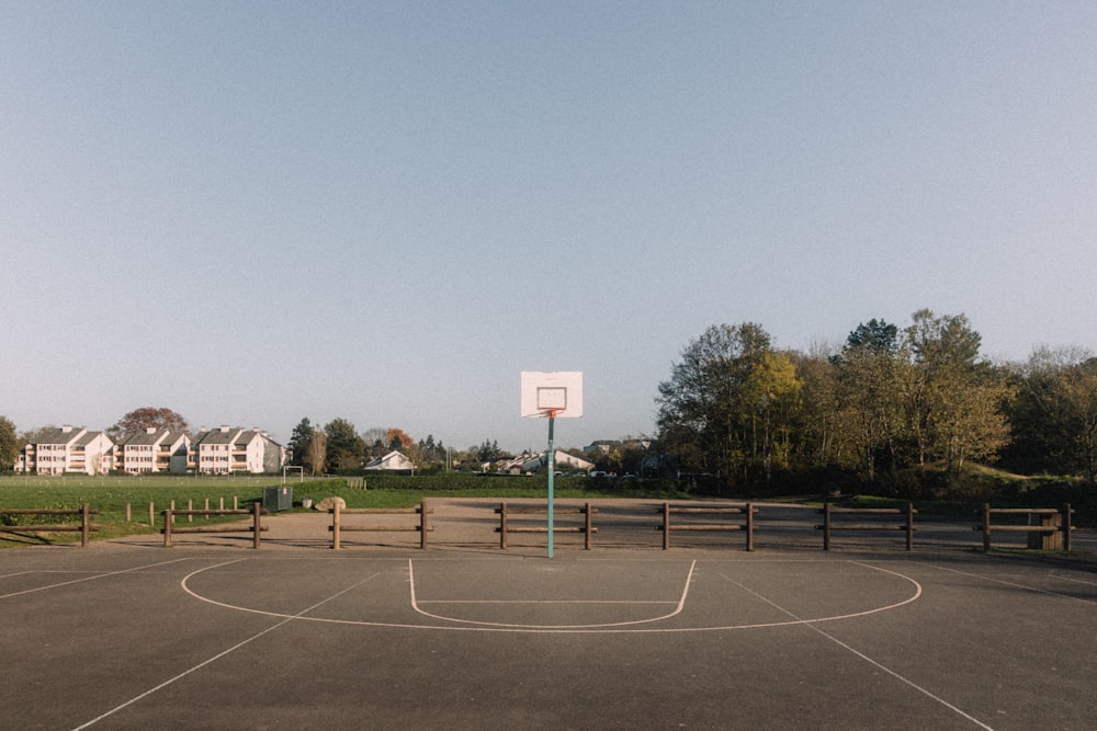 a basketball court with a basketball hoop in the middle of it