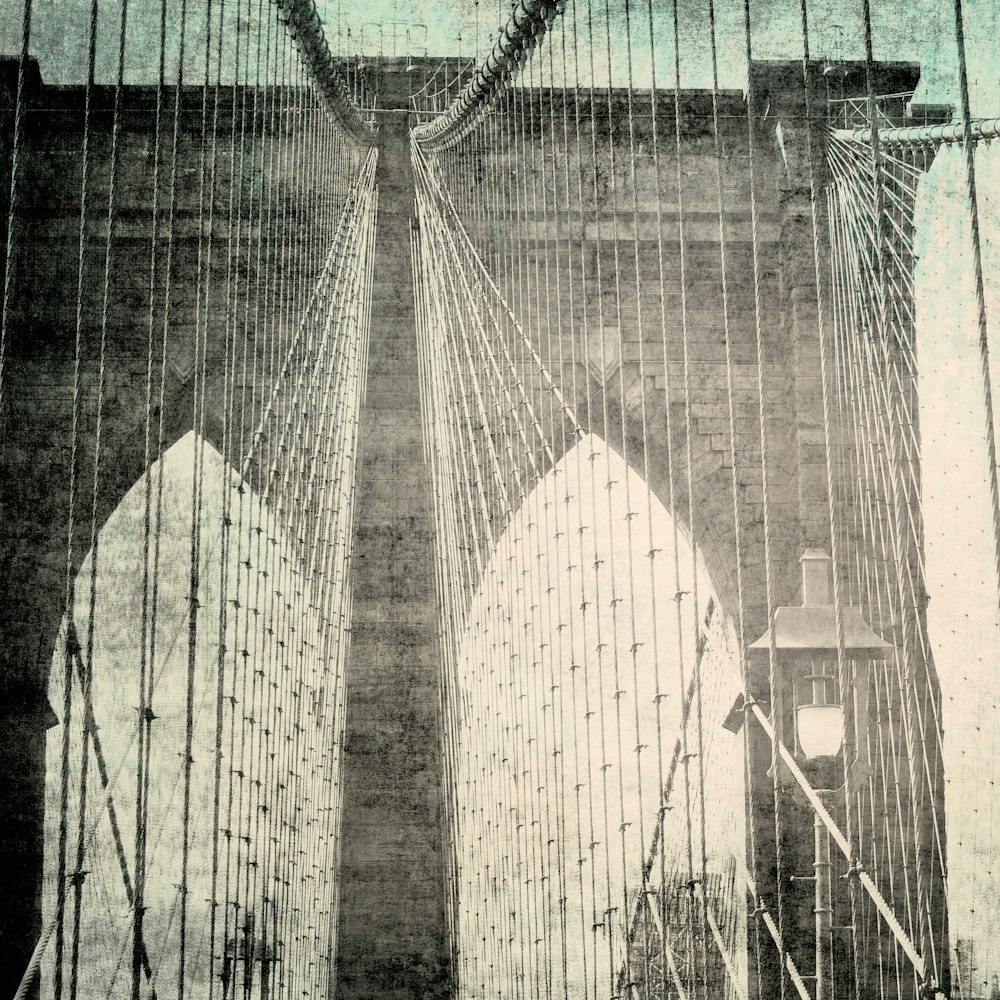 a black and white photo of the brooklyn bridge