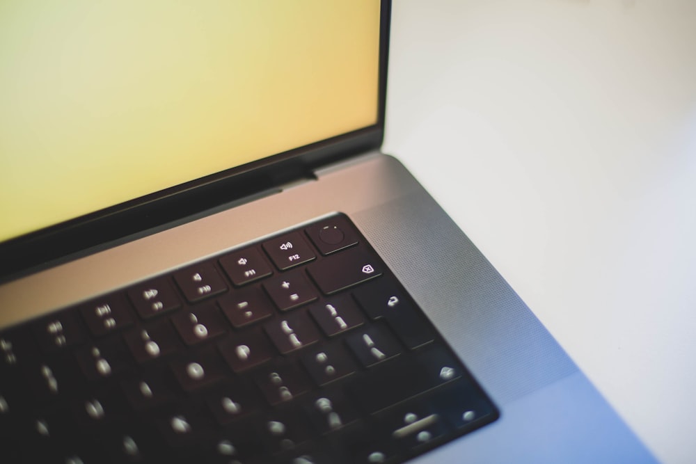 a close up of a laptop computer keyboard