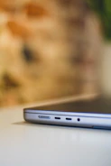 Close-up of a high-quality USB-C hub connected to a laptop with multiple devices attached.