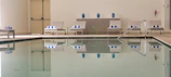 A stylish poolside setup featuring elegant accessories and maintenance products.