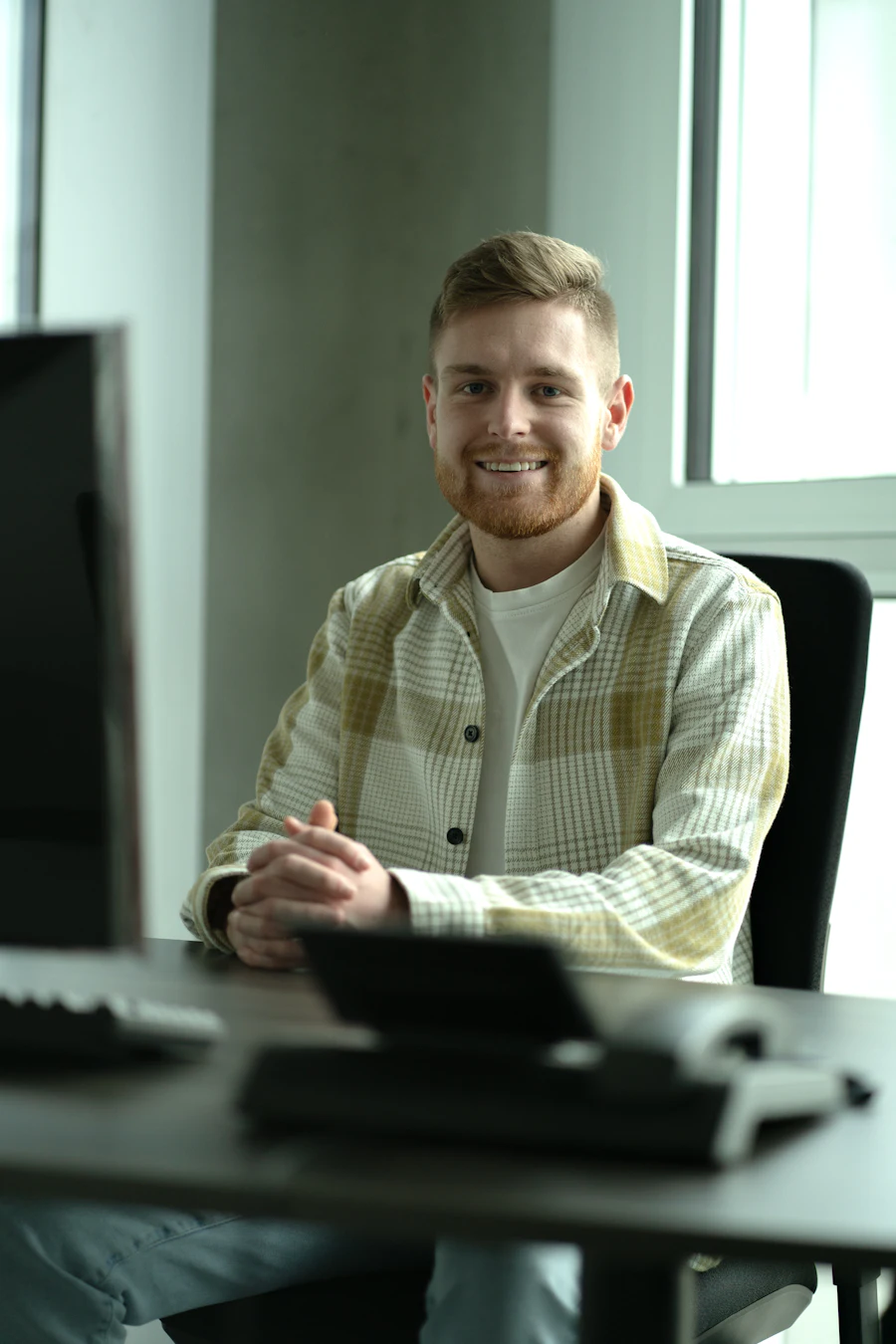 Man at a desk in front of a computer