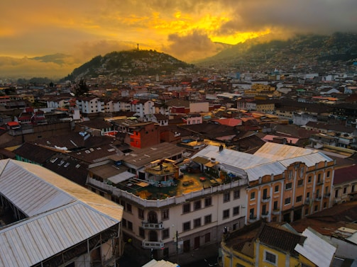 A vibrant photo of Rio de Janeiro's Christ the Redeemer statue at sunset with city lights glowing below.