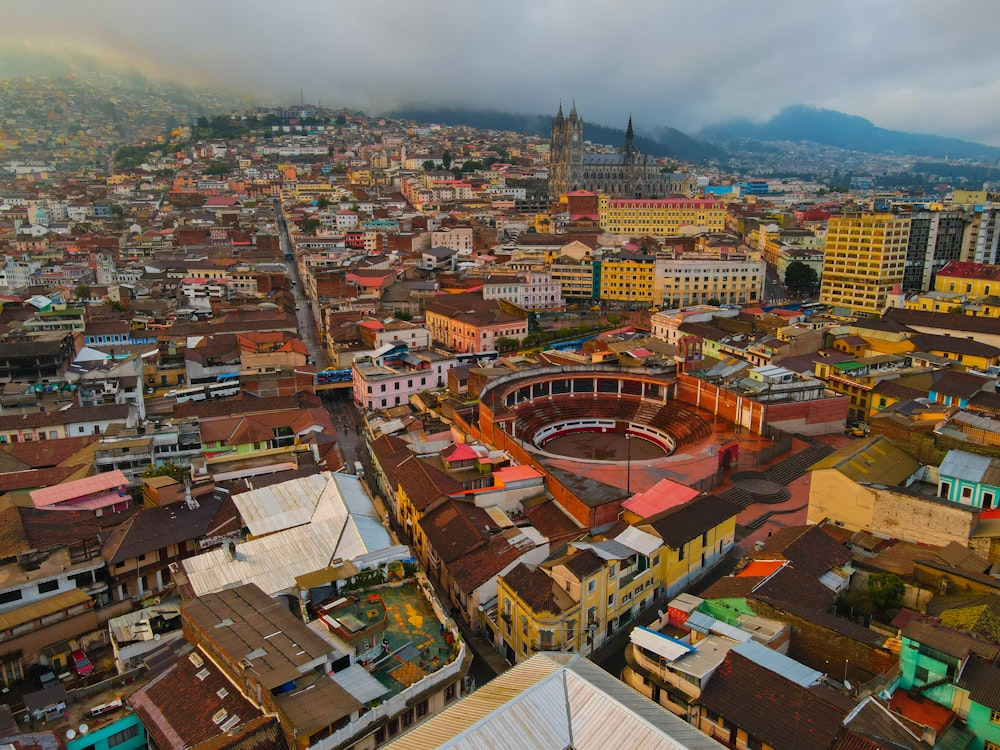 a view of a city with a rainbow in the sky