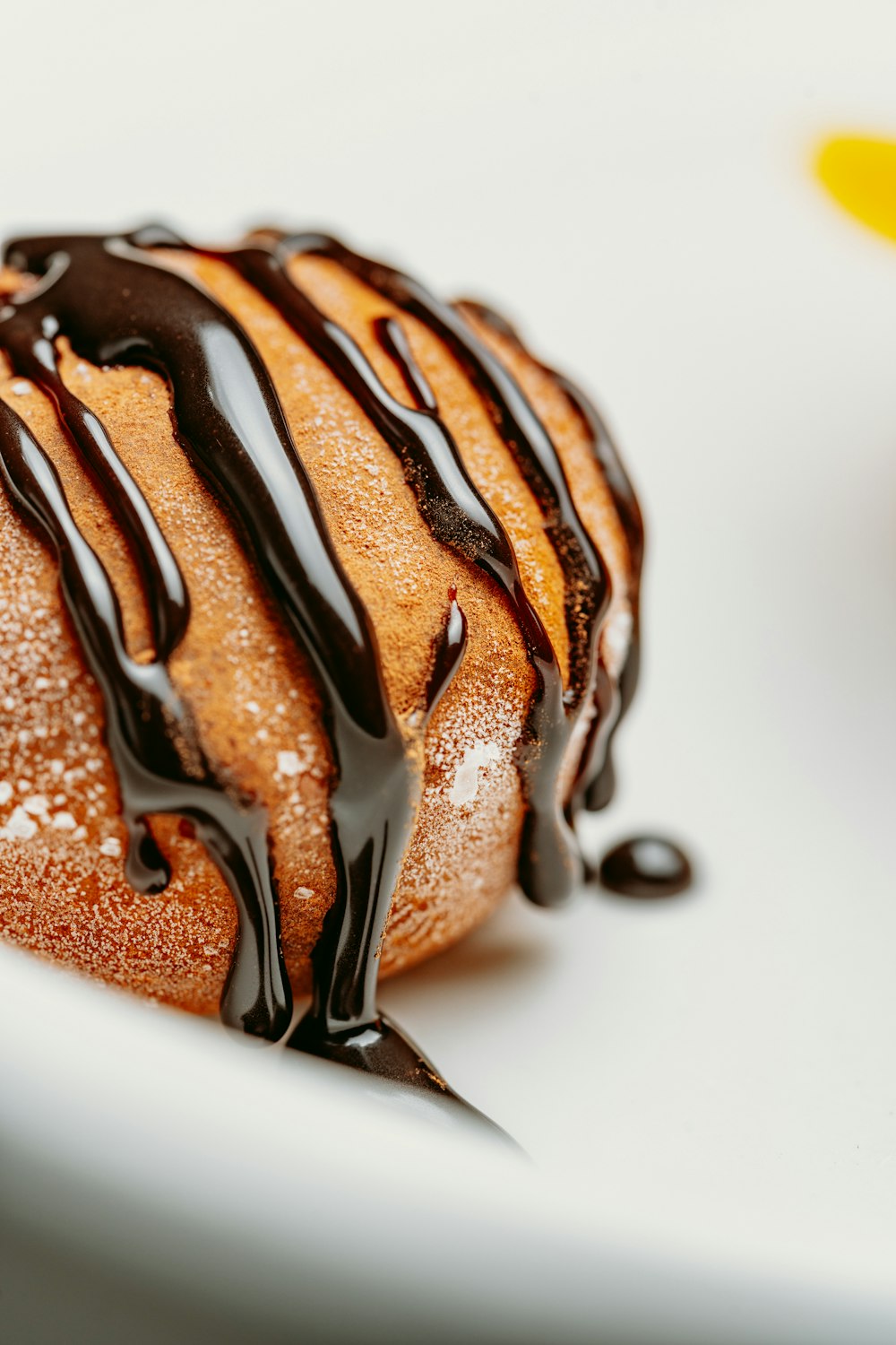 a pastry with chocolate drizzled on top of it