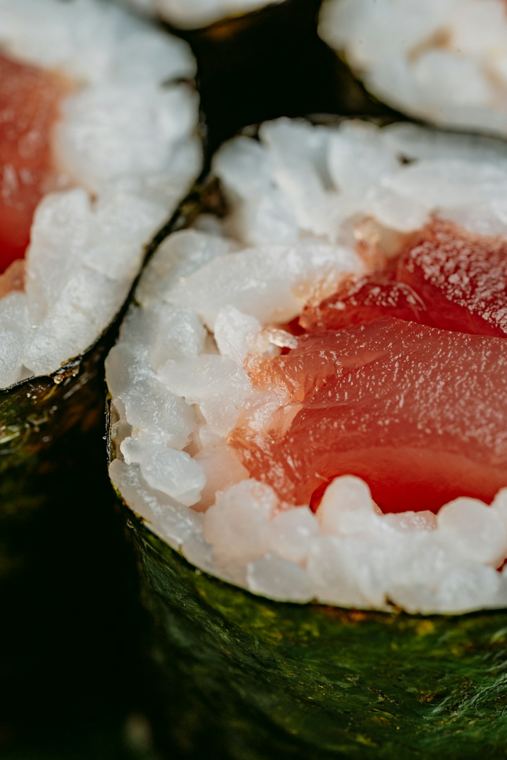 a close up of sushi with a lot of sushi sauce on it