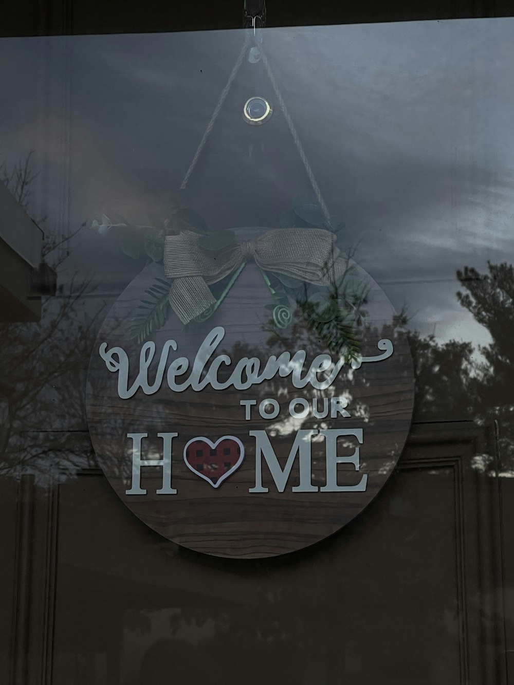 a sign that says welcome to our home
