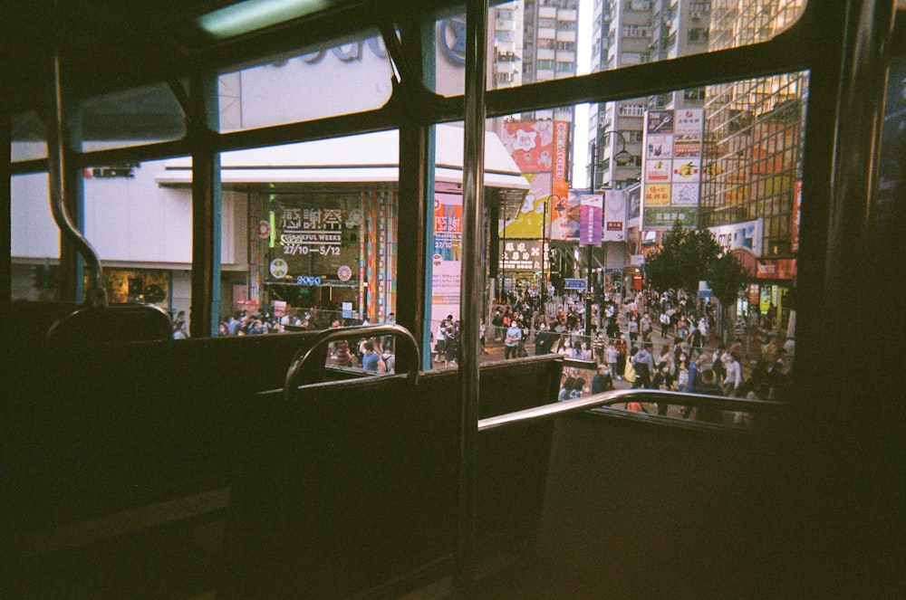 a crowded city street filled with lots of people