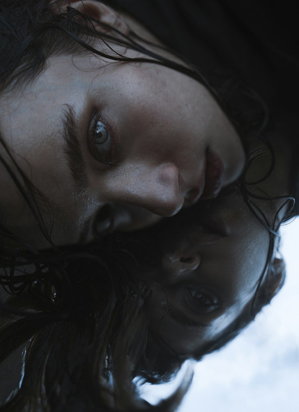 a close up of a woman with wet hair