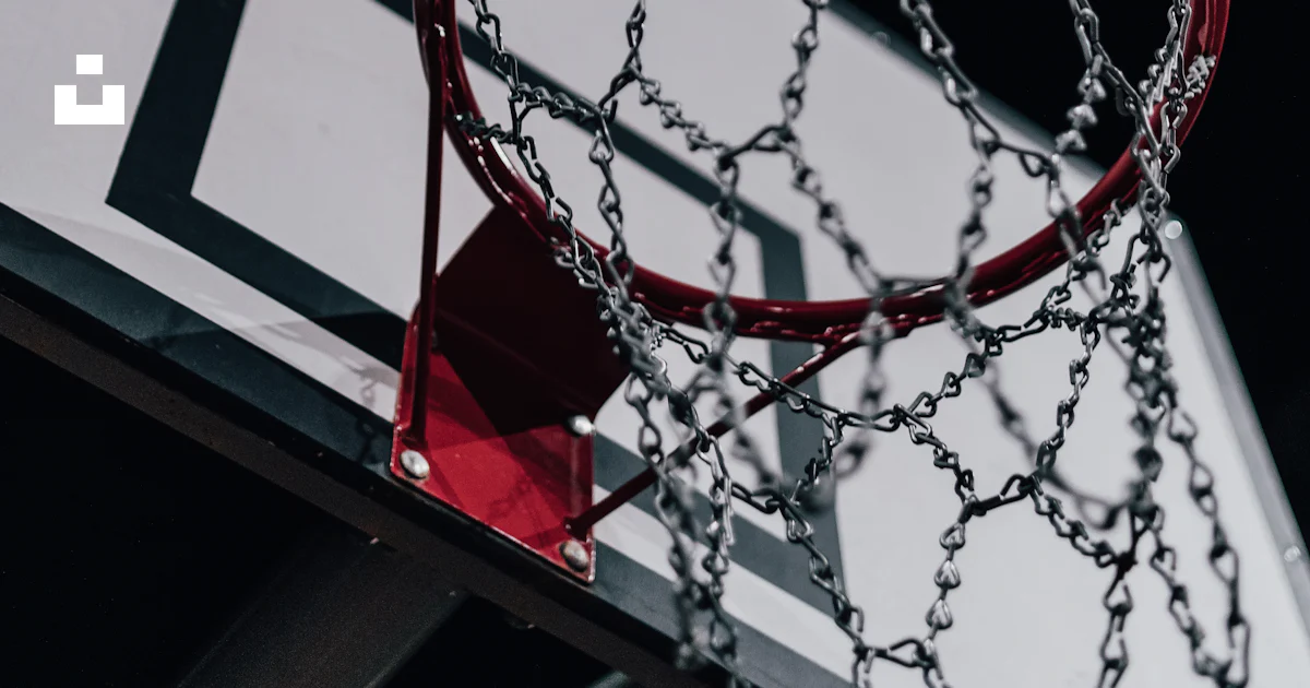 A close up of a basketball hoop with chains on it photo – Free ...