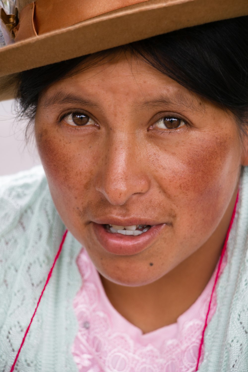 a close up of a person wearing a hat