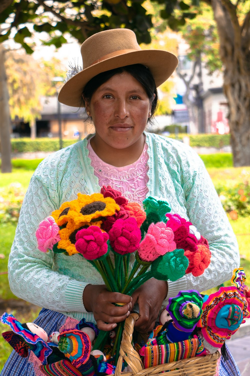 a woman holding a basket full of flowers