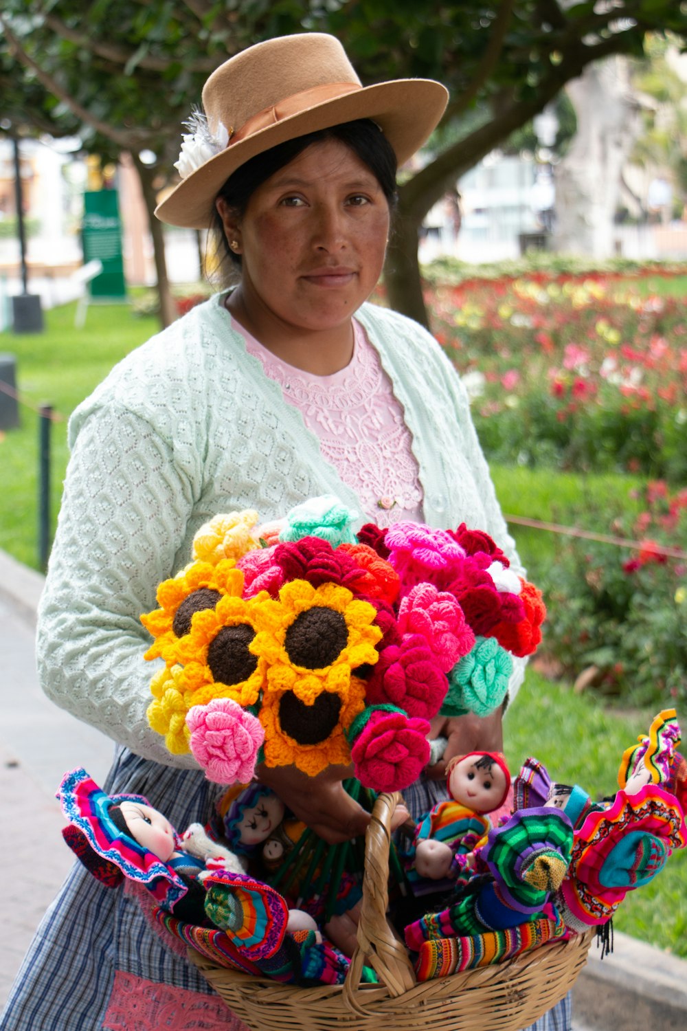 a woman is holding a basket of flowers