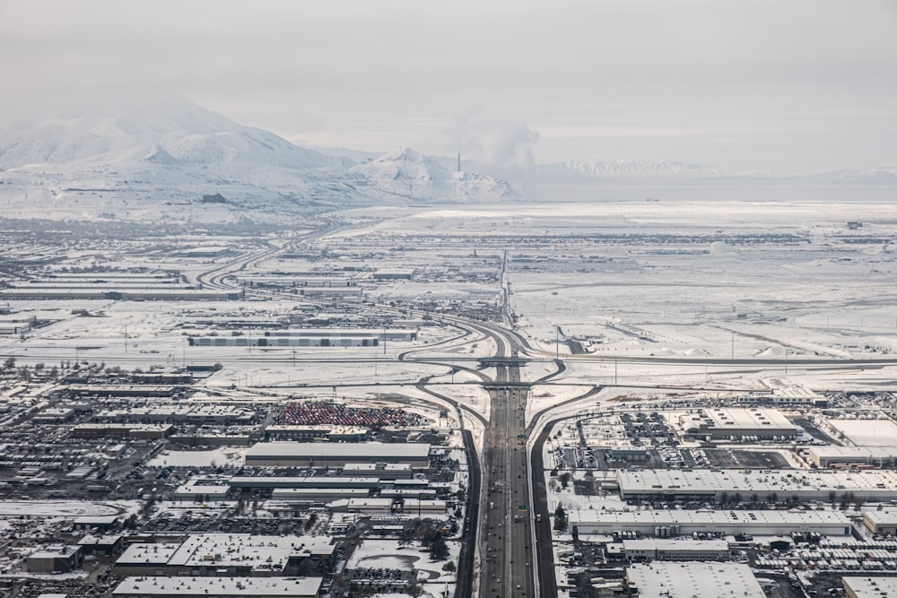 an aerial view of a city in the snow