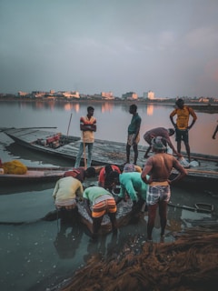 A group of people enjoying a fishing trip on a river.
