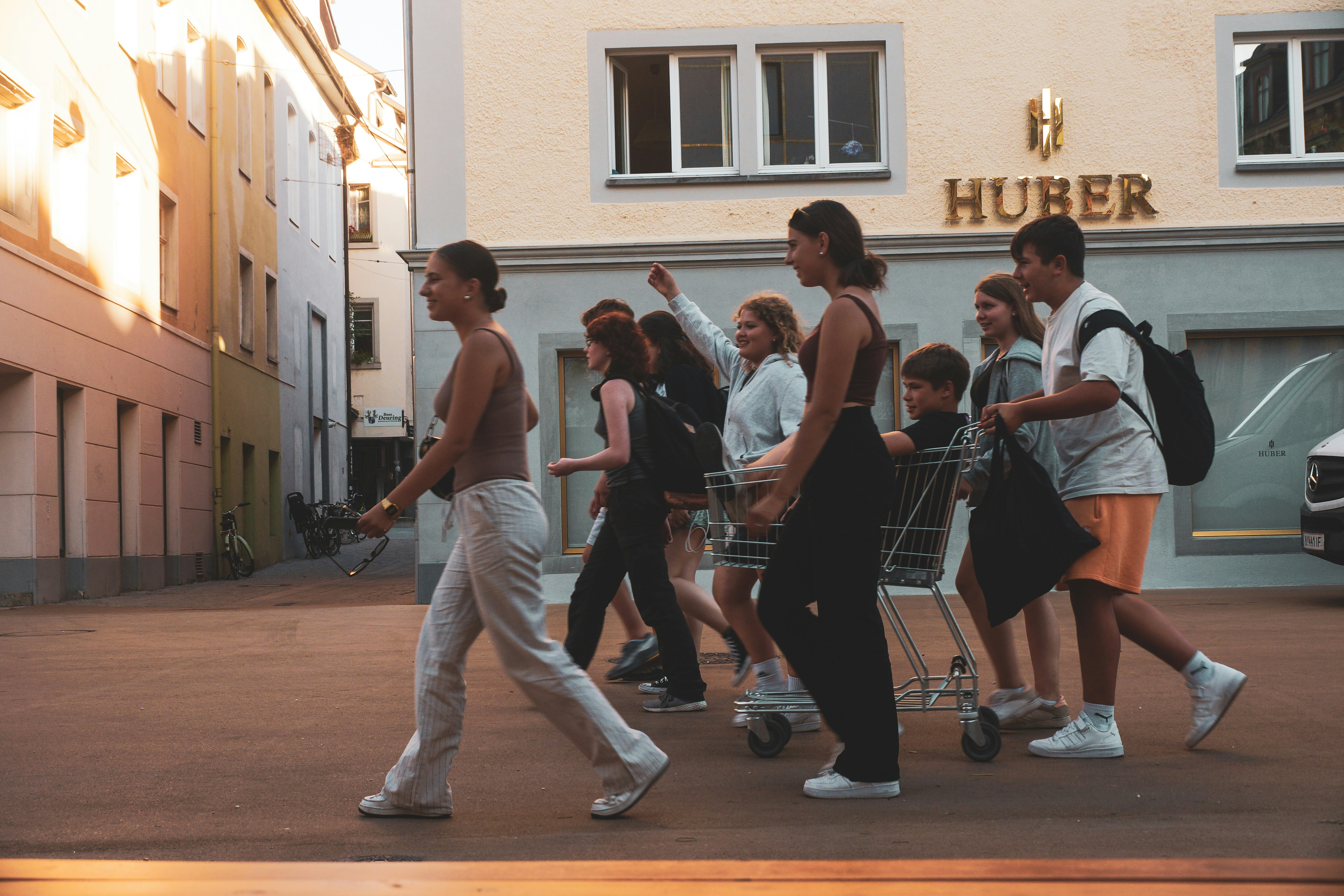 a group of people walking down a street