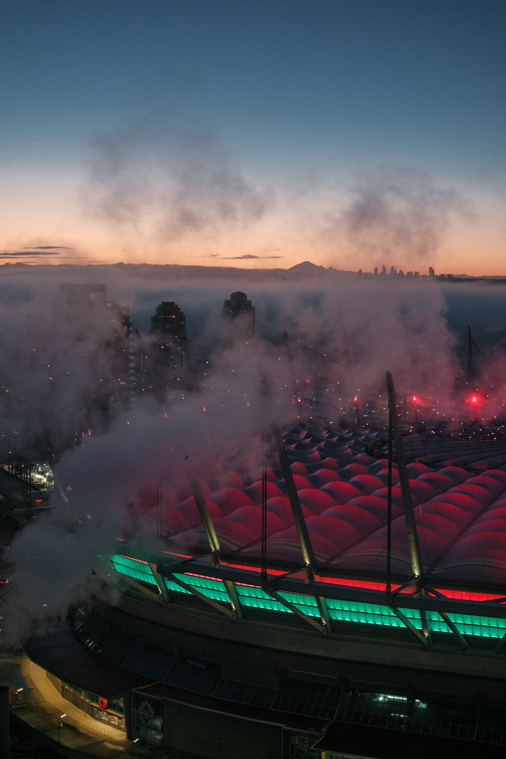 a stadium with a lot of smoke coming out of it