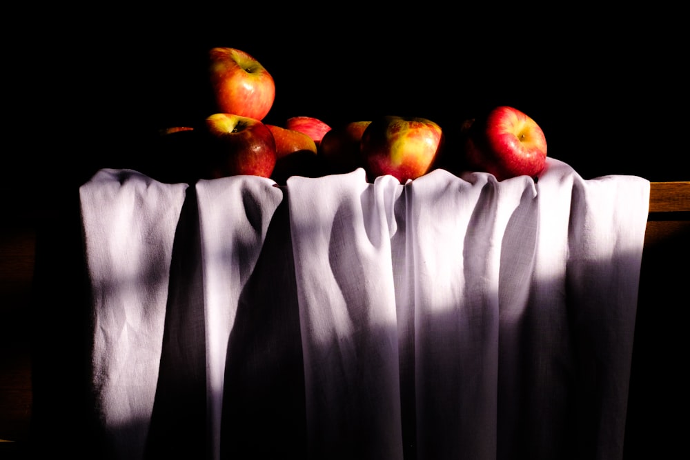 a group of apples sitting on top of a table