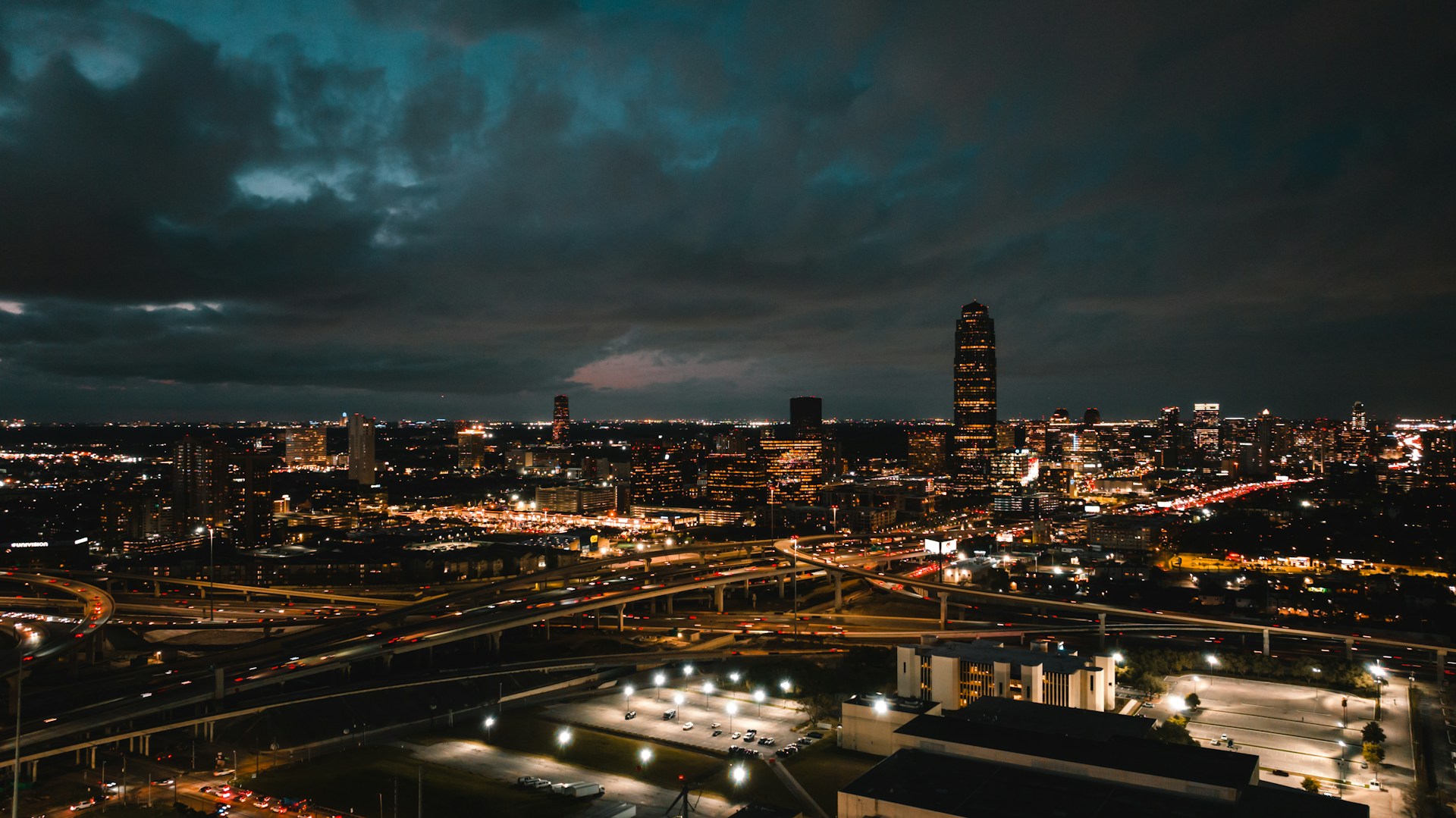 a view of a city at night from the top of a building