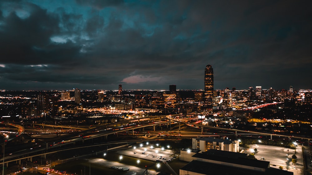 a view of a city at night from the top of a building