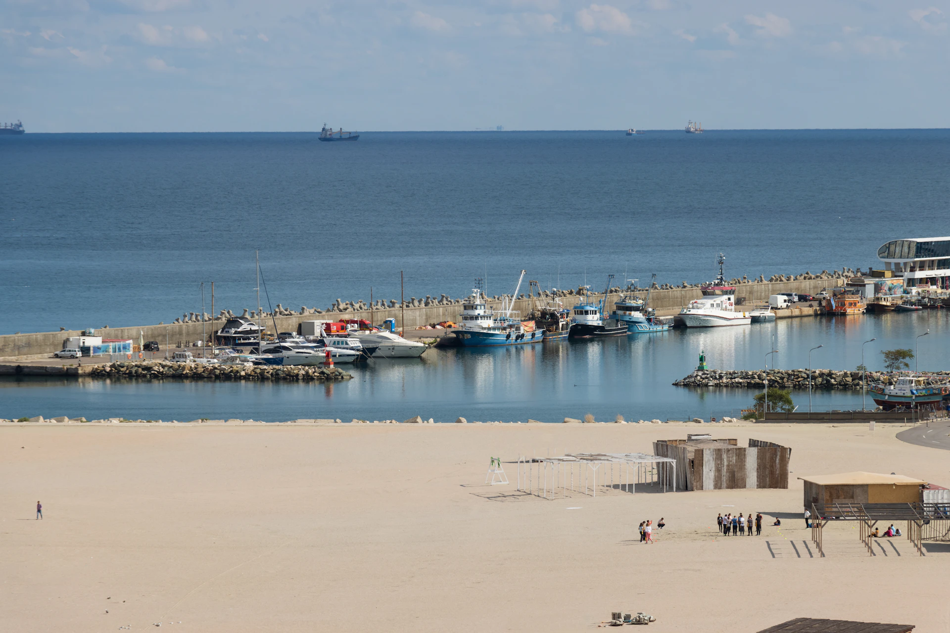 A high-resolution shot of the nearby beach and sailboats, capturing the peaceful atmosphere that guests enjoy at Brisamar.