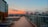 A spacious terrace overlooking the Hong Kong skyline at sunset.