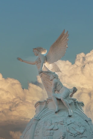 a statue of a woman on top of a building