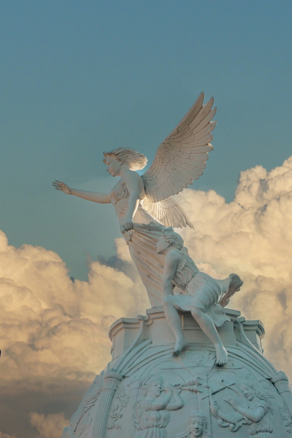 a statue of a woman on top of a building