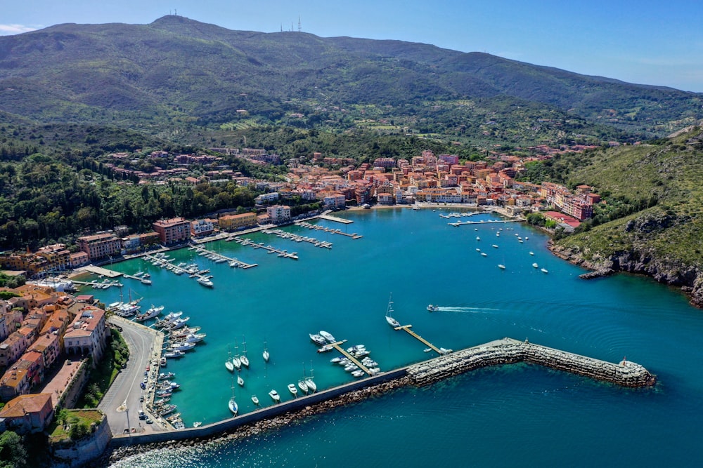 an aerial view of a harbor with boats in it