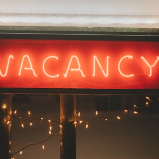 a neon sign that says vacancy on it