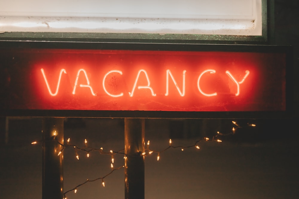 a neon sign that says vacancy on it