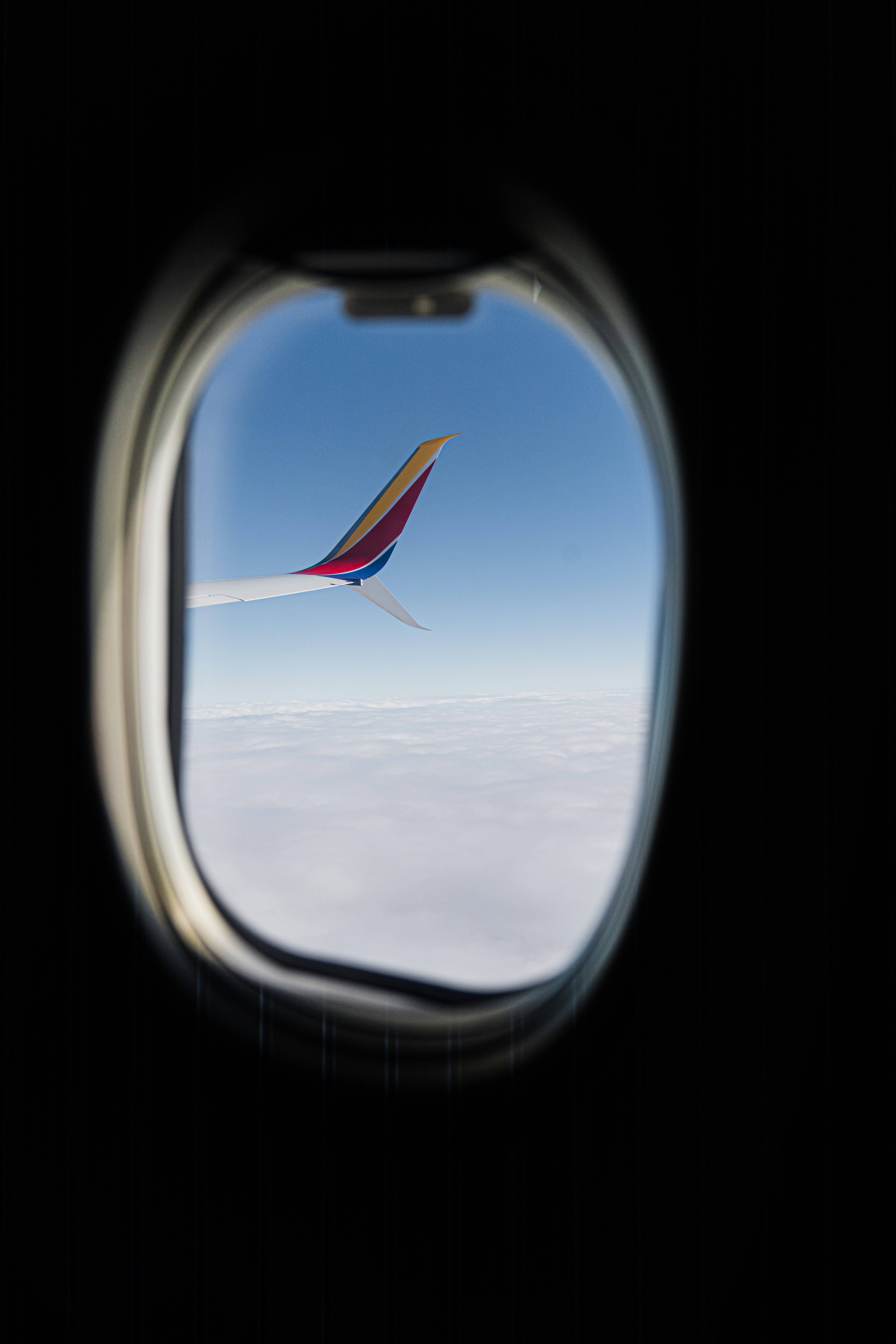 a view of the wing of an airplane through a window