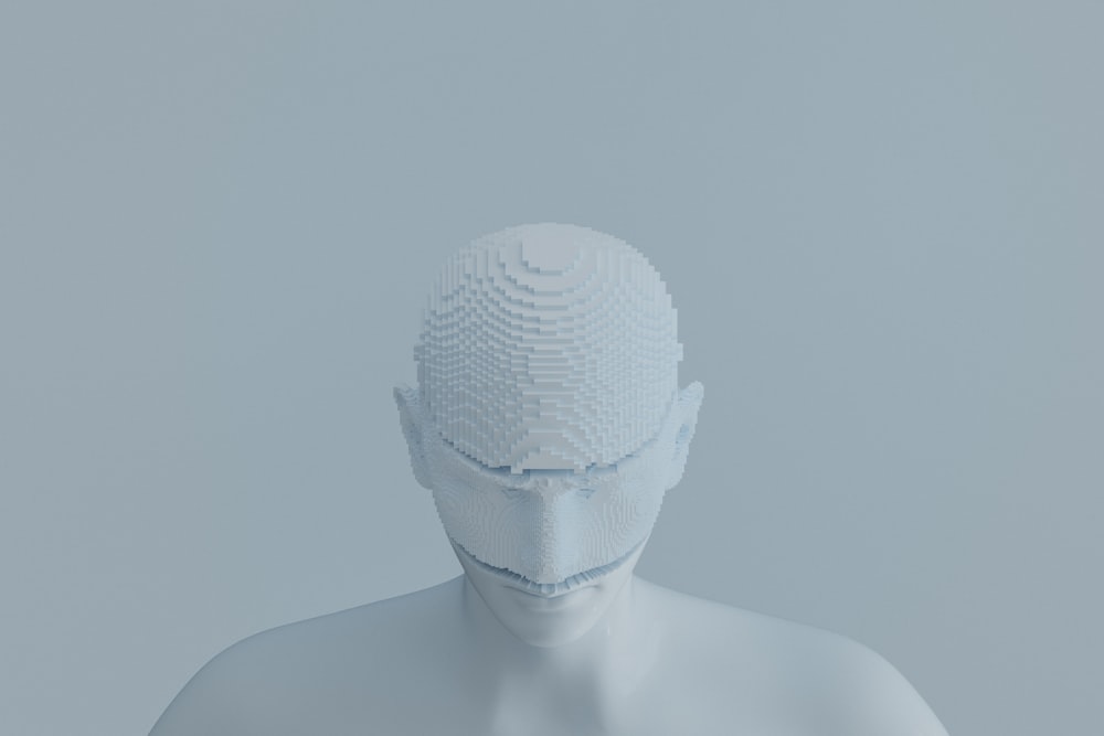 a white mannequin wearing a white mask