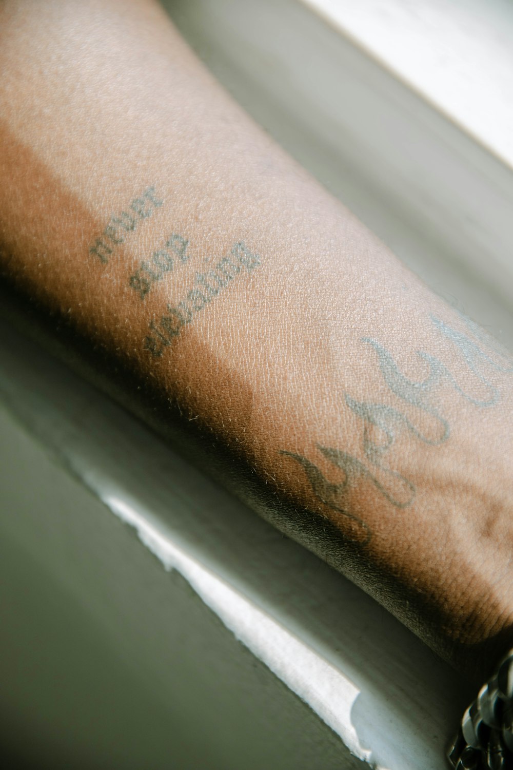 a close up of a person's arm with writing on it