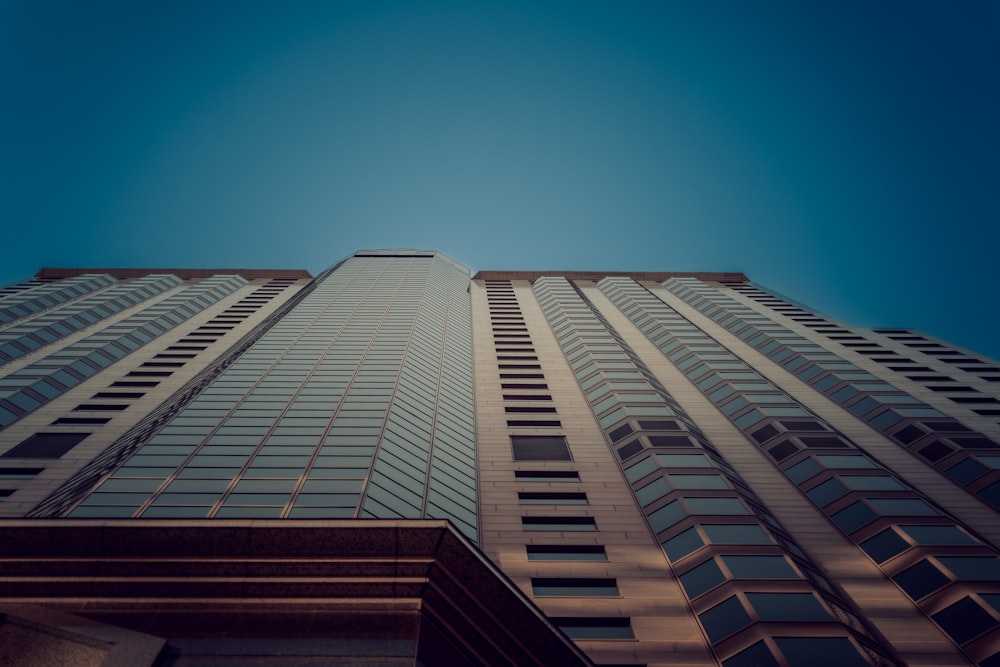 looking up at a tall building from the ground