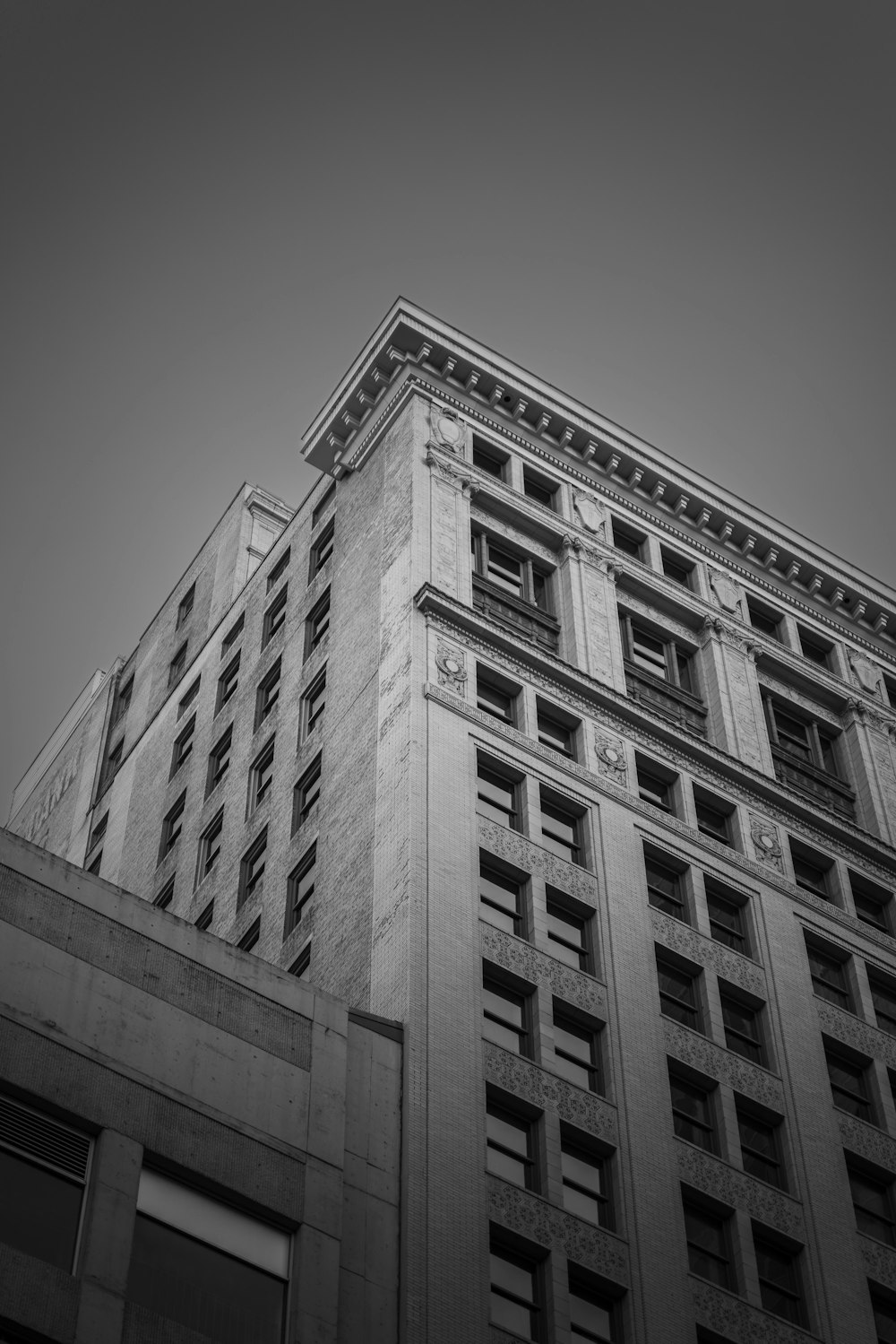 a black and white photo of a tall building