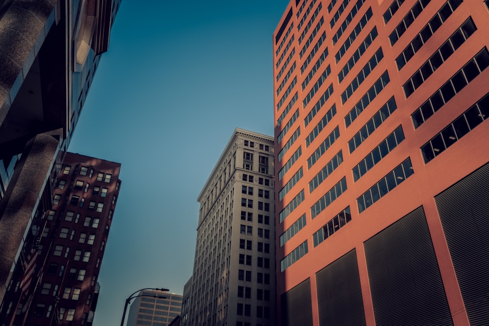 a couple of tall buildings sitting next to each other