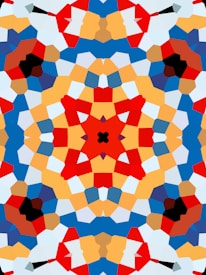 A vibrant, symmetrical kaleidoscope pattern featuring bold geometric shapes in various colors. The design is complex, with intersecting lines and layered segments creating a visually appealing mosaic-like effect.