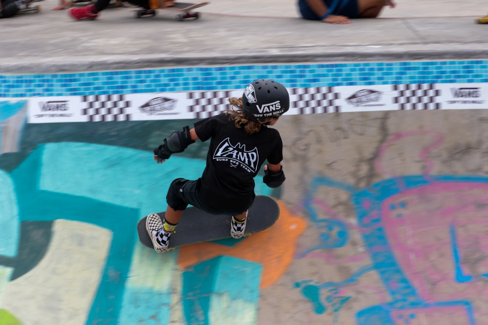 a person riding a skate board on a ramp