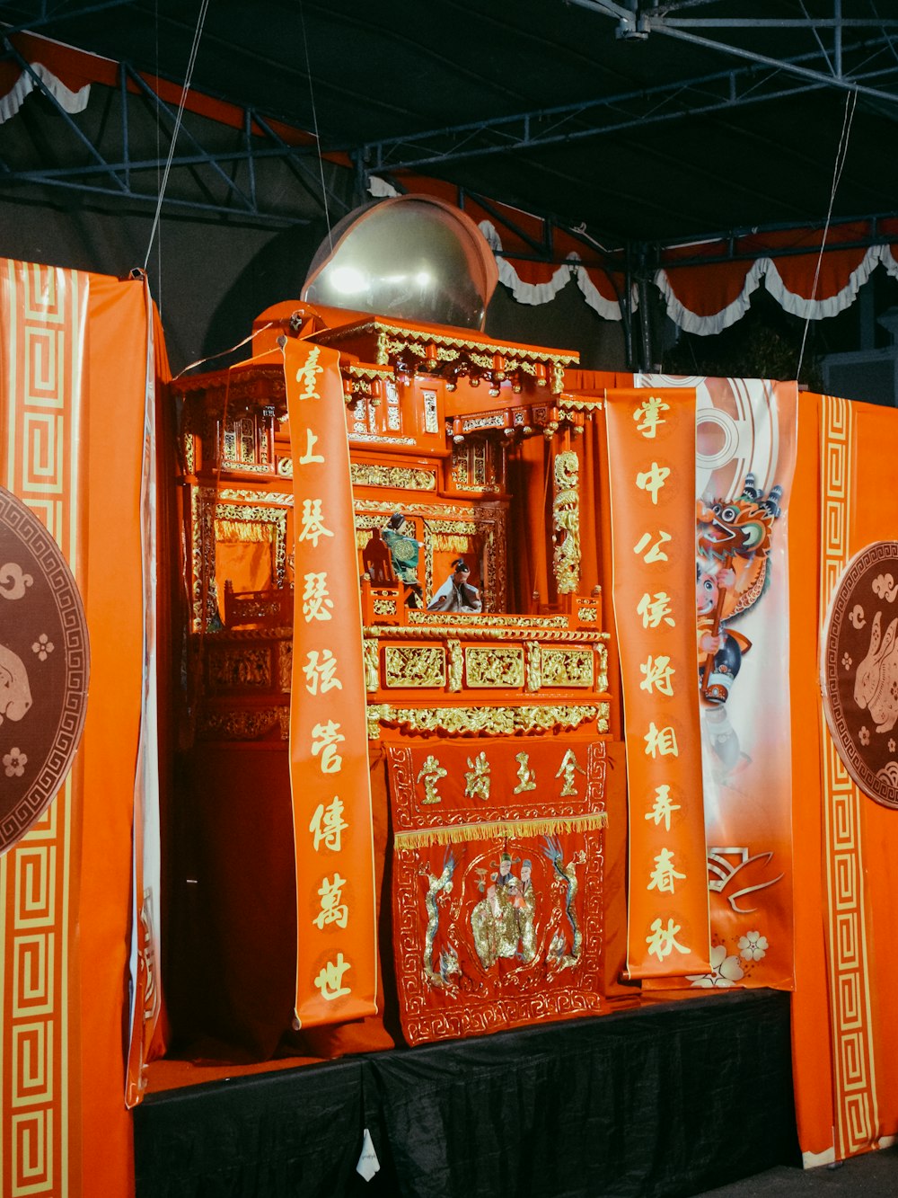 a display of orange and gold decorations in a room
