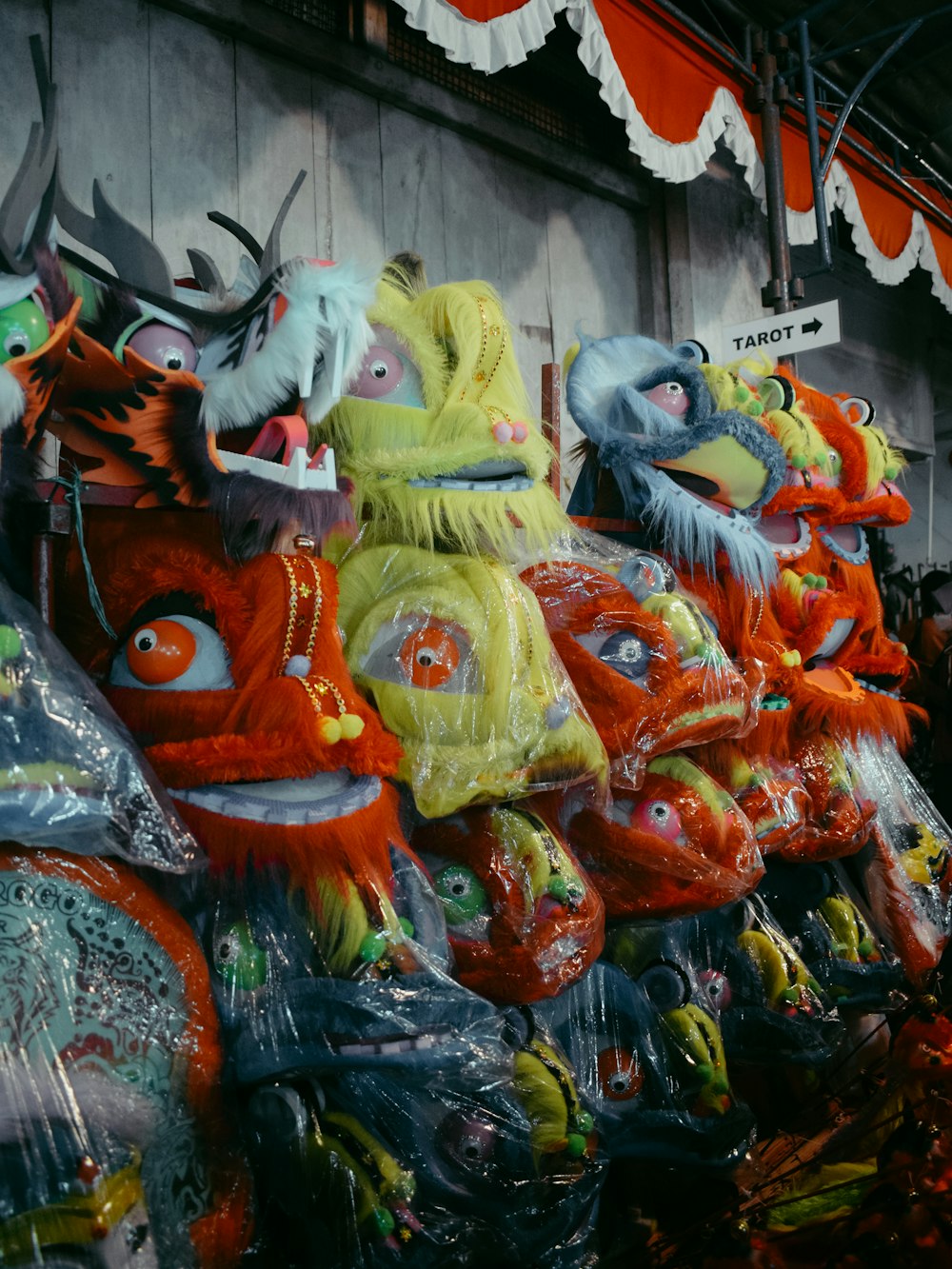 a row of colorful masks on display in a store